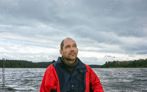 Mature Man Against A Overcast Landscape With A Lake © Svetlana Sukhorukova