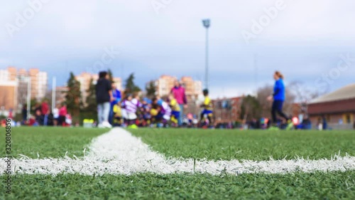unrecognizable children's rugby tournament, unfocused view