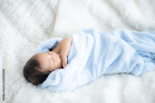 The baby is sleeping on a s...