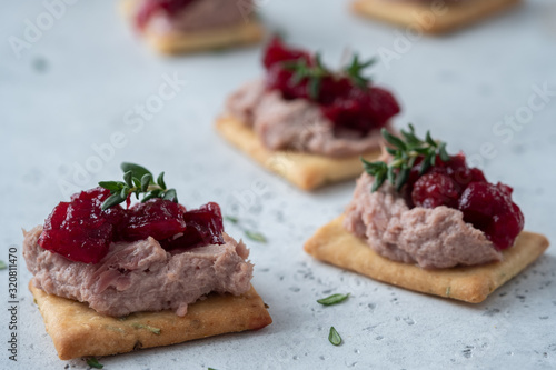 Rosemary Cracker with pate and cranberry sauce