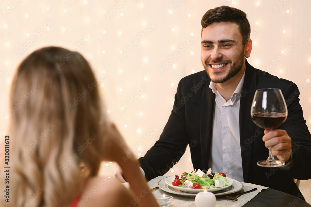 Handsome Man Making Toast On Romantic Dinner With His Girlfriend Handsome Man Making Toast On Romantic Dinner With His Girlfriend