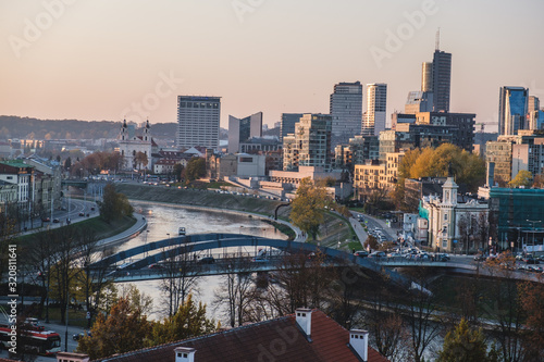 Vilnius modern financial district panorama at dusk from Gediminas tower with Neris river running in between