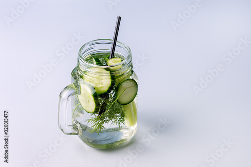 Glass Jar of Tasty Fresh Infused Water Made With Organic Vegetable Cucumber and Celery Healthy Detox Drink