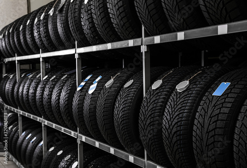 Car tires on rack in auto store photo