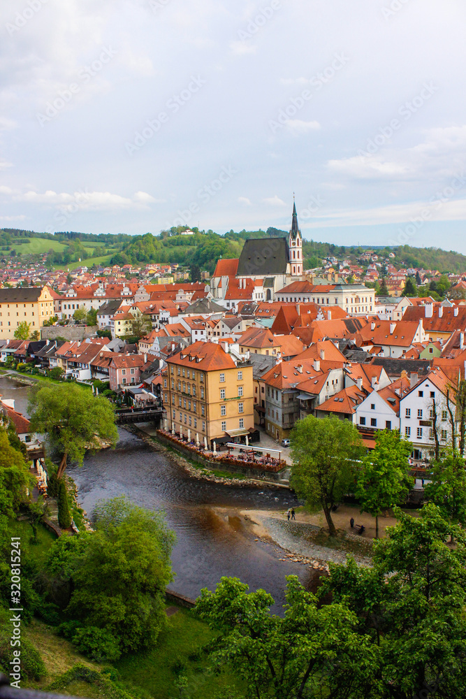 Vertical picture of Cesky Krumlov taken from the Castle, with Vltava river at the foreground and St. Vitus Church at the background