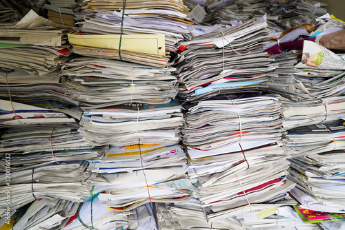 close up view of stacks of paper and magazines and newspapers ready to be recycled photo