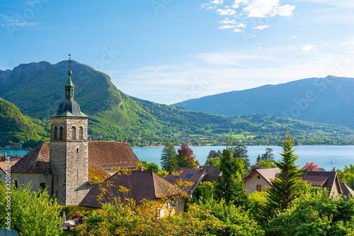charming view on Annecy lake with old church in France