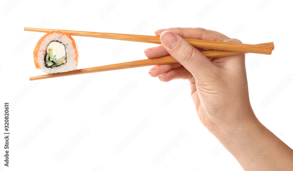 Woman holding sushi roll on white background, closeup Woman holding sushi roll on white background, closeup