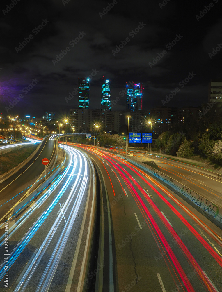 Obraz premium Night with traffic long exposure 4 towers of Madrid