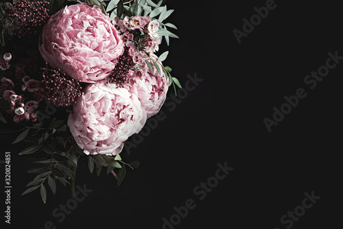 Fototapeta Naklejka Na Ścianę i Meble -  Bouquet of beautiful flowers on black background, space for text. Floral card design with dark vintage effect