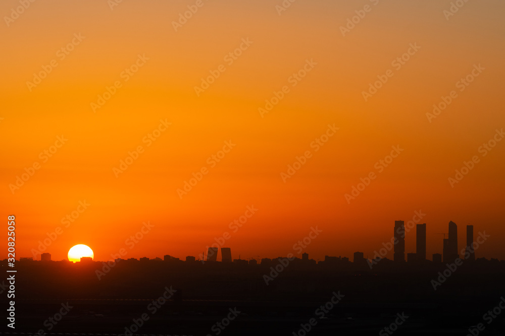 View of Madrid skyline at sunset showing the main skyscrapers View of Madrid skyline at sunset showing the main skyscrapers