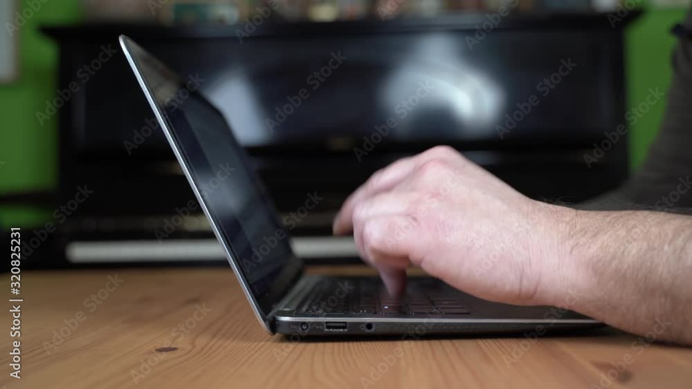 Man typing on laptop. Caucasian Man typing on laptop. Caucasian
