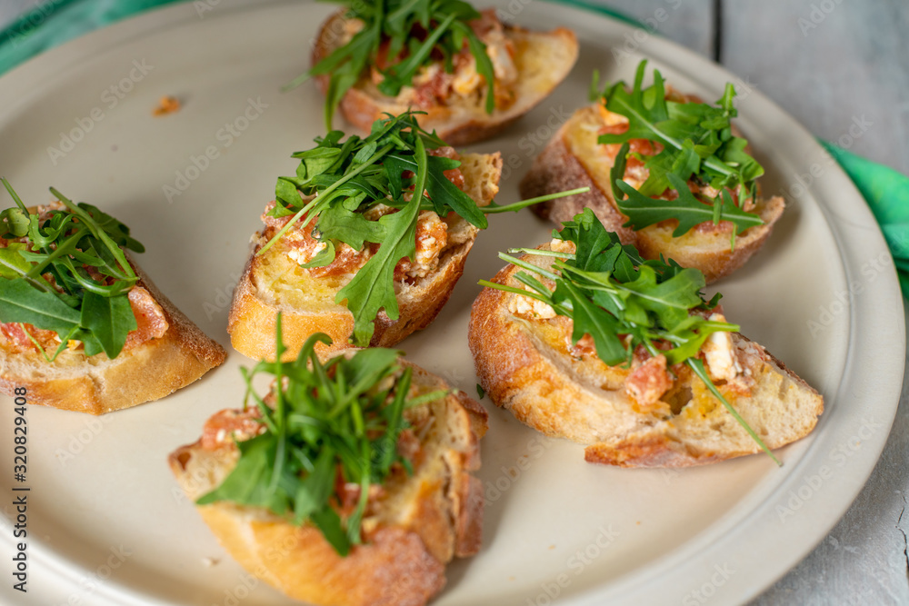 bruscetta with tomatoes, mozzarella and arugula bruscetta with tomatoes, mozzarella and arugula