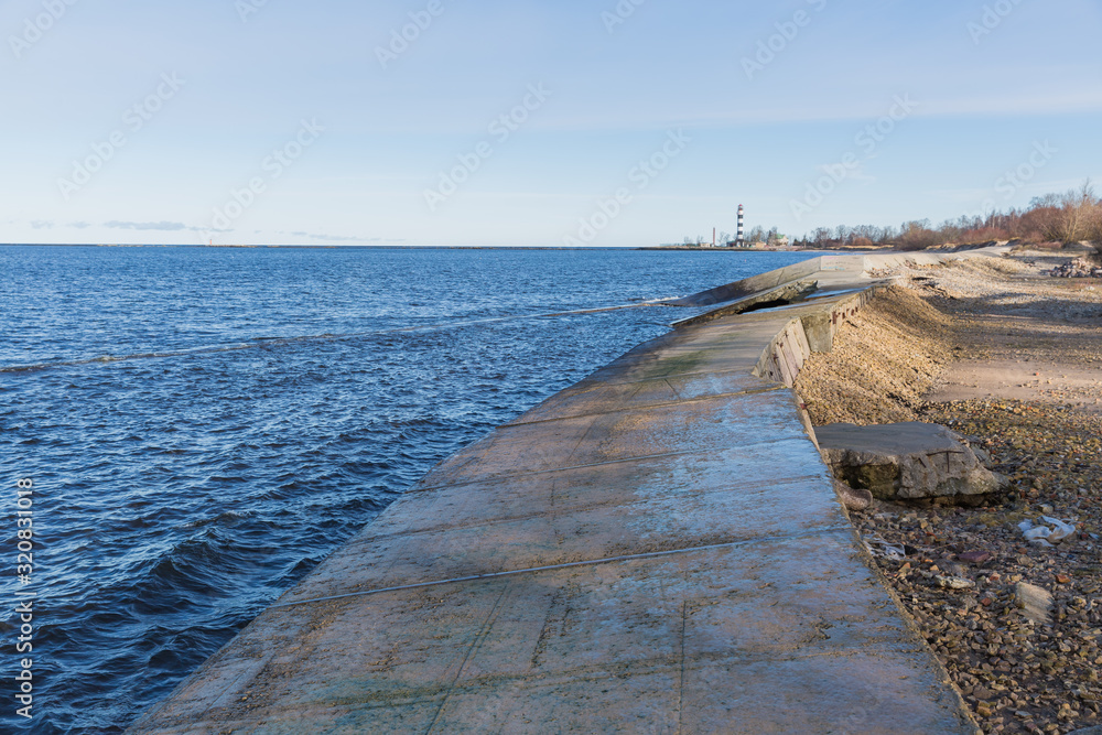 City, Riga, Latvia. Baltic Sea with waves and mole. Travel photo.