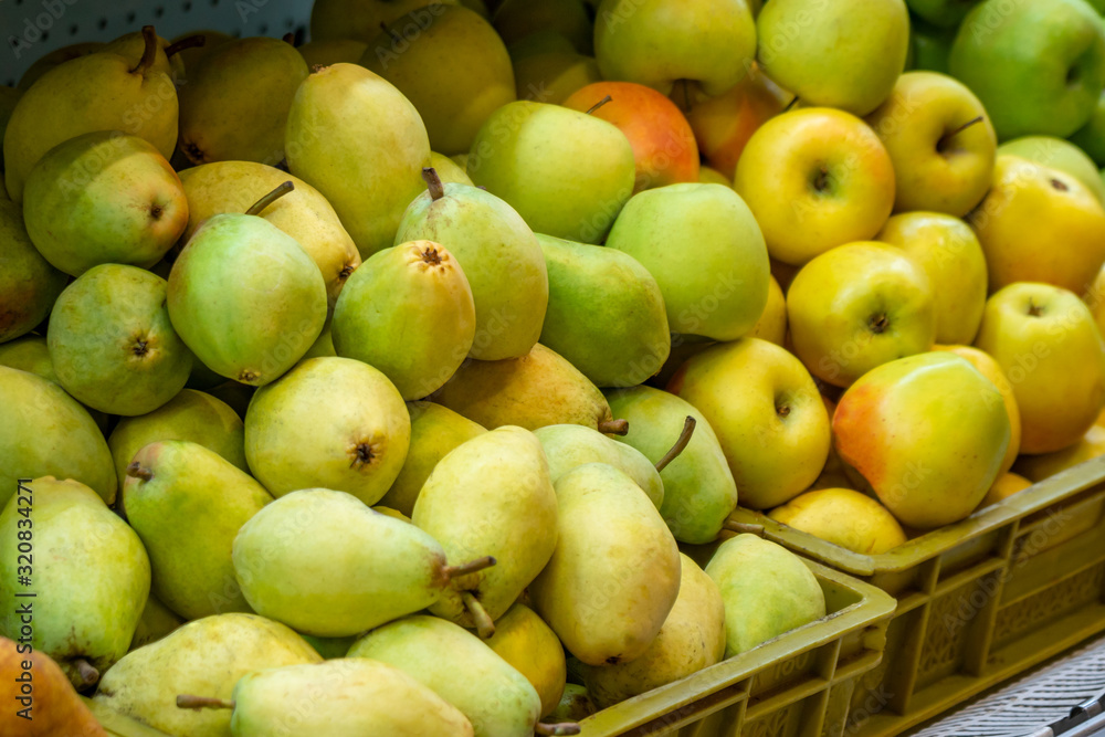 Various fruits in the market for sale.