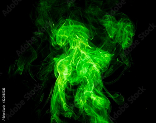 Green smoke on black background