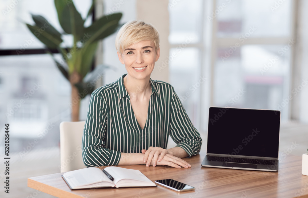 Successful Entrepreneur Posing Smiling To Camera At Workplace In Office Successful Entrepreneur Posing Smiling To Camera At Workplace In Office