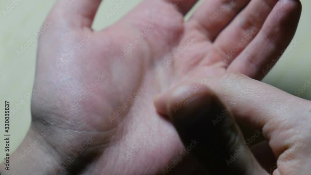 Palmistry. A man shows an individual line drawing on the skin of the palm Palmistry. A man shows an individual line drawing on the skin of the palm
