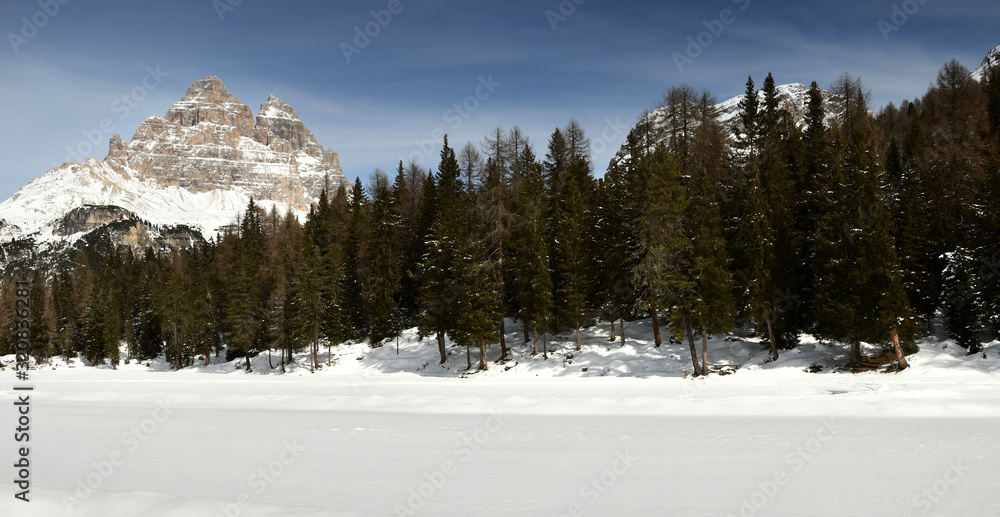 Scenic winter landscape at Antorno Lake in the Sexten Dolomites with Drei Zinnen (Tre Cime di Lavaredo). Veneto Italy.