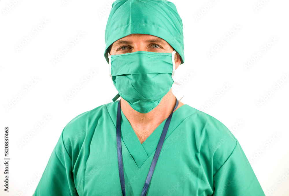 hospital clinic staff corporate portrait of attractive and successful medicine doctor smiling confident in green medical clothes and protective face mask and bouffant cap hospital clinic staff corporate portrait of attractive and successful medicine doctor smiling confident in green medical clothes and protective face mask and bouffant cap