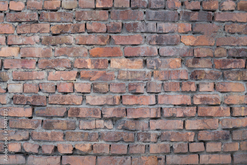 The texture of the brickwork of red brick.