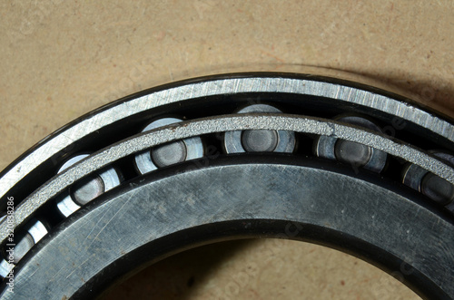 Macroview into an assembled roller bearing, where the rolls can be seen in their guide. photo