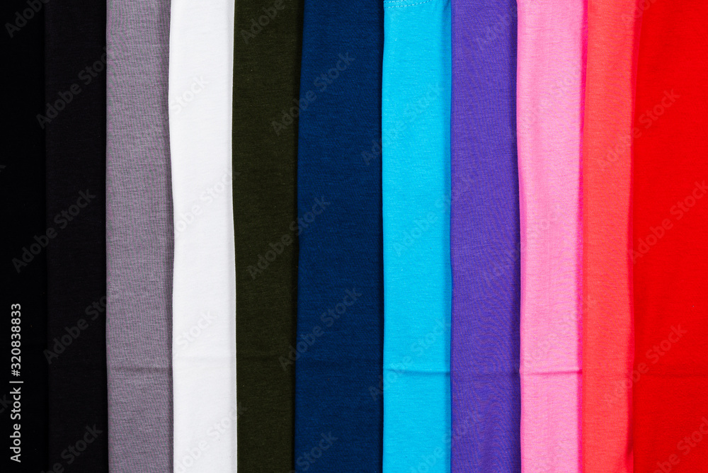 Naklejka premium Close up Stack of Colorful cotton T shirt for bacground