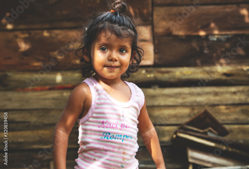 Cute little Mexican girl. Childhood. Portrait of young girl, Mexican ethnicity, outside.