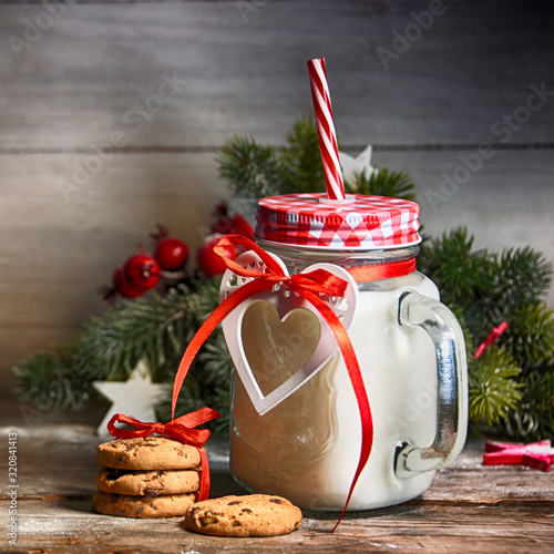 Rustic Christmas background with milk and cookies to Santa