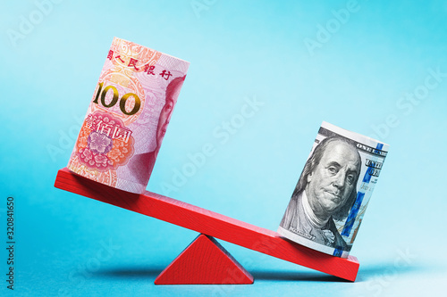 Dollars and yuan on a swing. Strong american currency concept