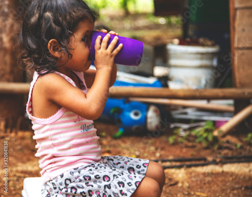Cute little Mexican girl. Childhood. Portrait of young girl, Mexican ethnicity, outside.