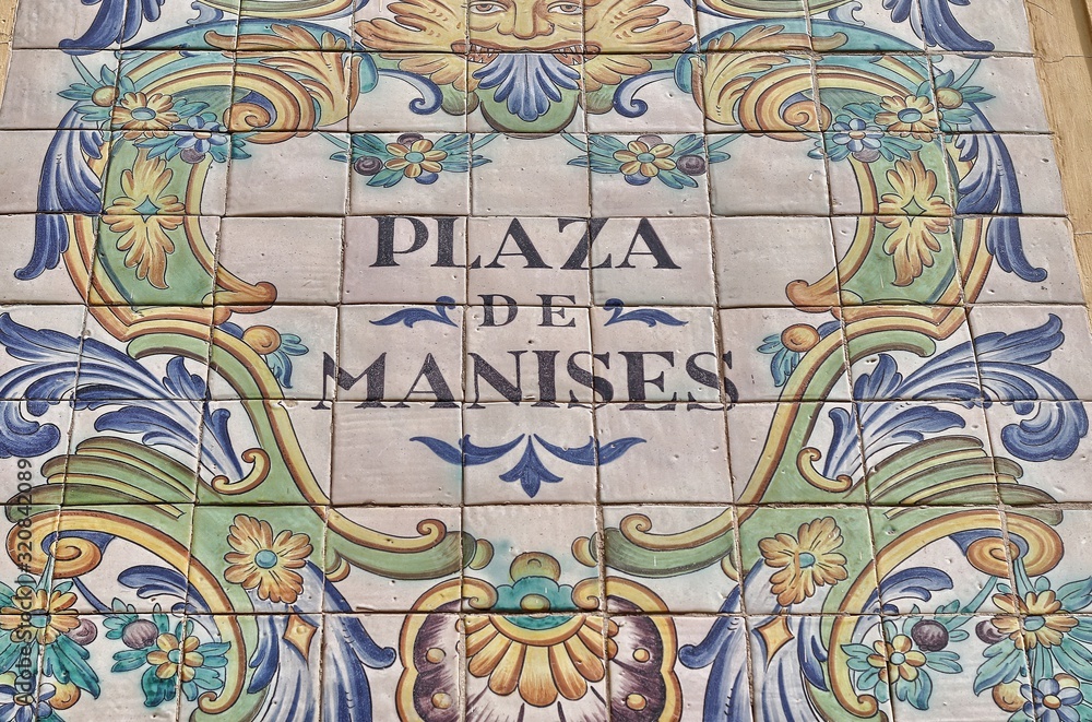 Ceramic tiles street sign of the Manises square in Valencia, Spain