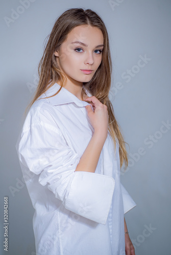 Caucasian woman model posing indoors. Girl is always happy to hear interesting stories. photo