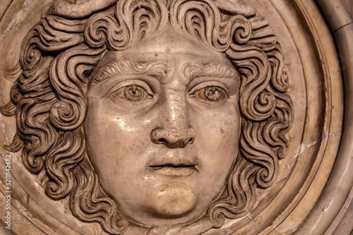 Medusa face sculpture. Head portrait of MedusaIn Greek mythology Medusa was a monster, a Gorgon, a winged human female with a hideous face and living venomous snakes in place of hair