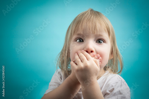 child covered his mouth with his hands. the child is sick of poisoning. gastroenteritis in children