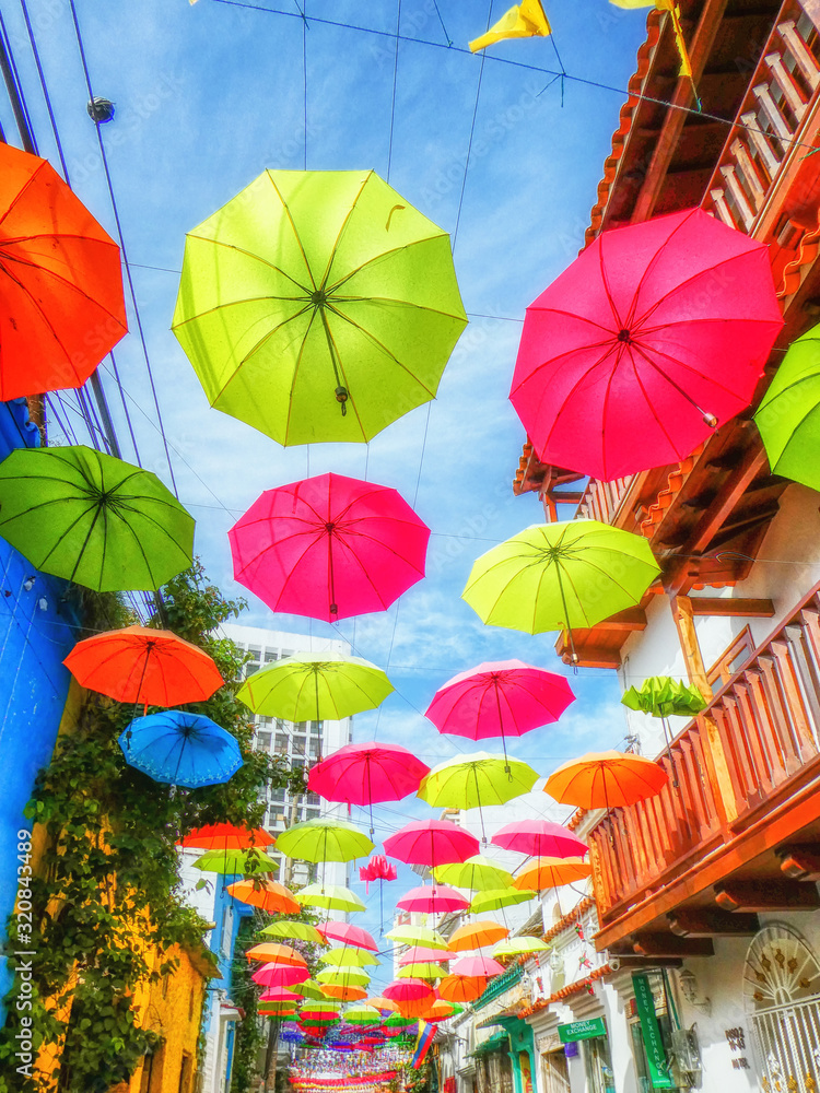 Street with umbrellas in Getsemani neighborhood in Cartagena de Indias