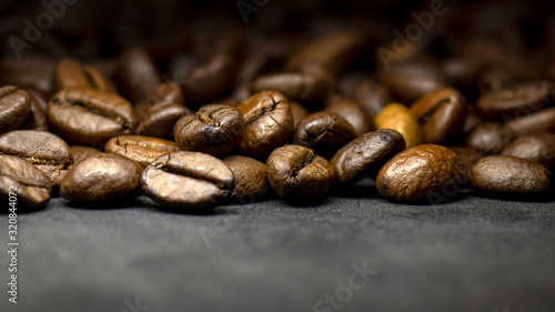 Wallpaper Mural Coffee in beans on dark background. Abstract background texture.Coffee beans texture. Food background of coffee beans Torontodigital.ca