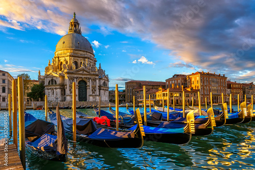 Εκτύπωση καμβά Sunrise view of Canal Grande with Venice gondola and Basilica di Santa Maria della Salute in Venice, Italy