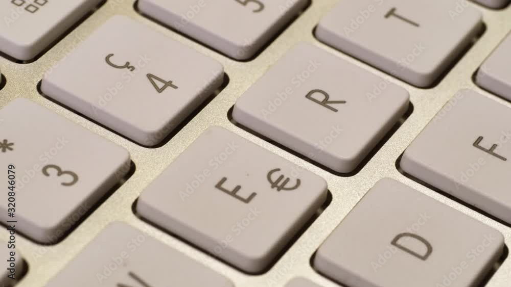 Dolly macro shot showing white keyboard console from computer,close up Dolly macro shot showing white keyboard console from computer,close up