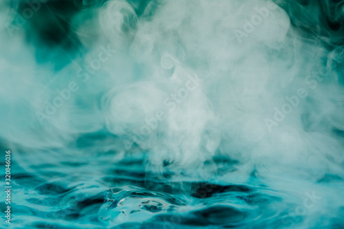teal blue abstract background with steam and water