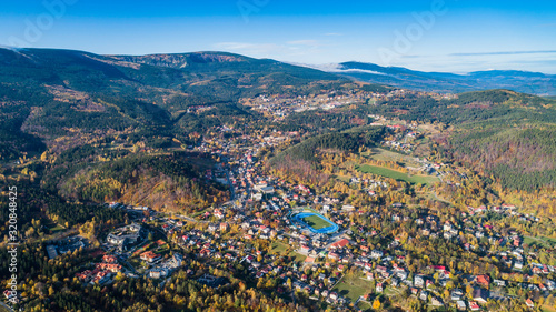 Aerial view of Karpacz city at the foot of Sniezka and the Karkonosze National Park © konradkerker