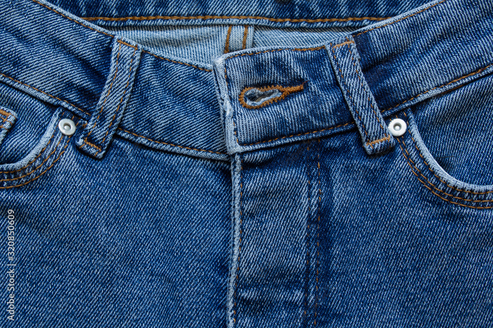 part of jeans with beautiful embossed stitching, seam, fabric texture, close-up, copy space part of jeans with beautiful embossed stitching, seam, fabric texture, close-up, copy space