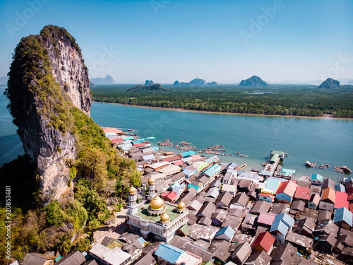 Beautiful landscape mosque sea and sky in summer at Punyi island, Ko Panyi or Koh Panyee, Muslim fisherman village landmark attractions travel by boat at Ao Phang Nga Bay National Park, Thailand, Asia photo