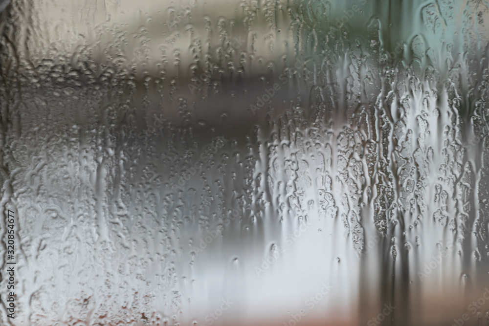 Rainy weather, raindrops on the glass of window, water drips wet. Texture, background. Rainy weather, raindrops on the glass of window, water drips wet. Texture, background.