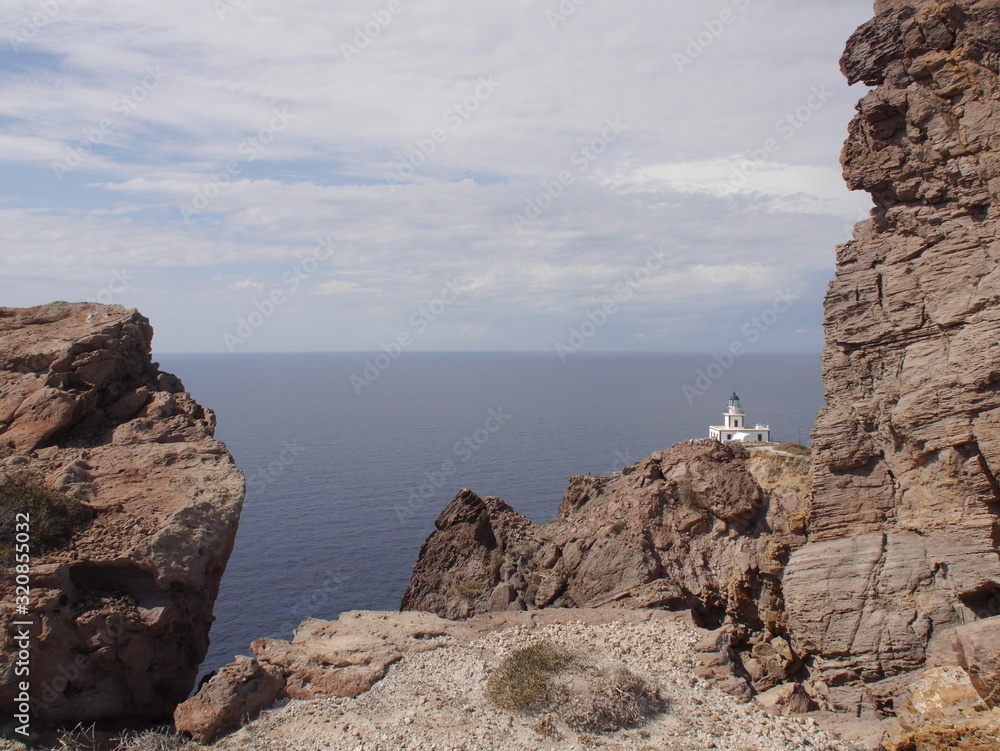 Views of the caldera, mountains, the Mediterranean Sea, and the city of Fira from the Akrotiri Lighthouse. Views of the caldera, mountains, the Mediterranean Sea, and the city of Fira from the Akrotiri Lighthouse.