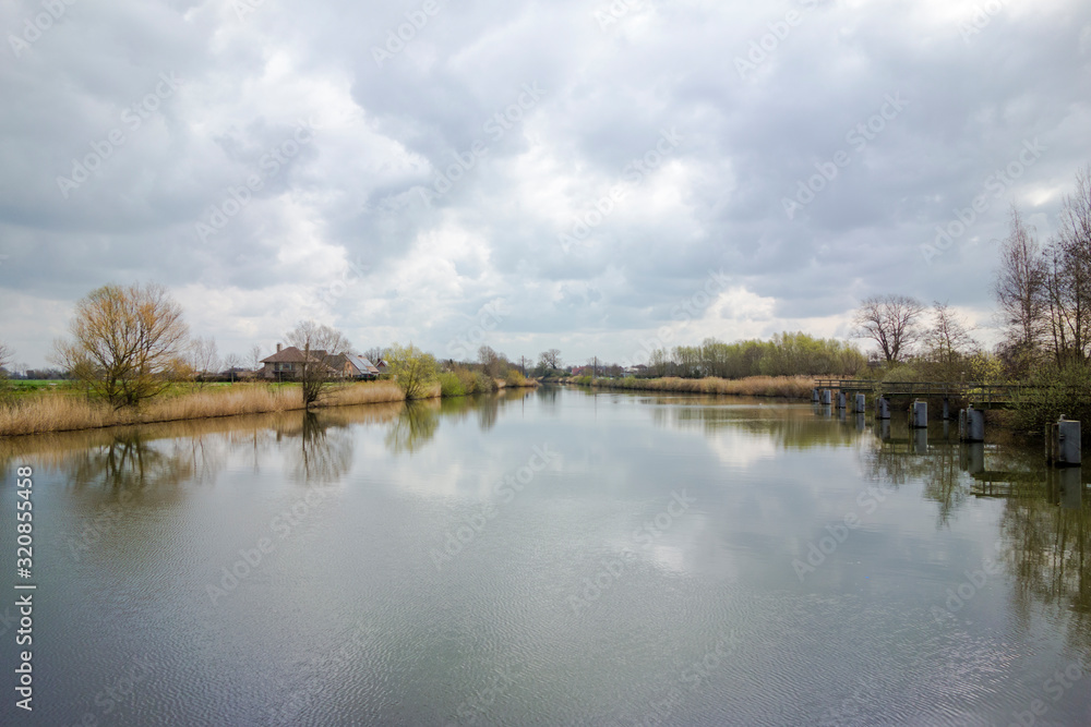 river field land clouds sky river field land clouds sky