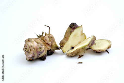 Raw organic Jerusalem artichoke ,Helianthus tuberosus, vegetable on white