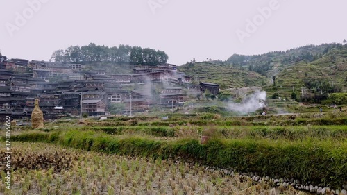wide panning shot of farm fields and city at Qiandongnan, Guizhou province, China, slow motion/high speed photo