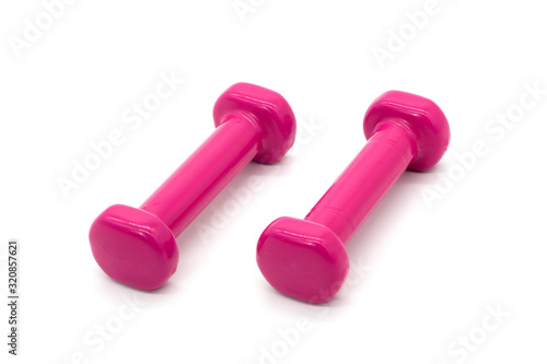 Baby pink dumbbells on a white isolated background