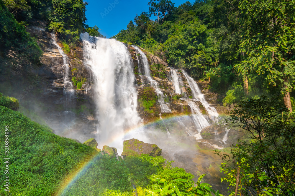 Wachirathan Waterfall at Doi Inthanon National Park, Mae Chaem District, Chiang Mai Province, Thailand. Fresh flowing water in tropical rainforest. Green trees, vibrant colors, tranquility Wachirathan Waterfall at Doi Inthanon National Park, Mae Chaem District, Chiang Mai Province, Thailand. Fresh flowing water in tropical rainforest. Green trees, vibrant colors, tranquility